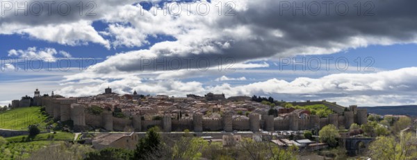Avila, Spain, 8 April, 2024: panorama view of the medieval walled city of Avila on a beautiful spring day, Europe