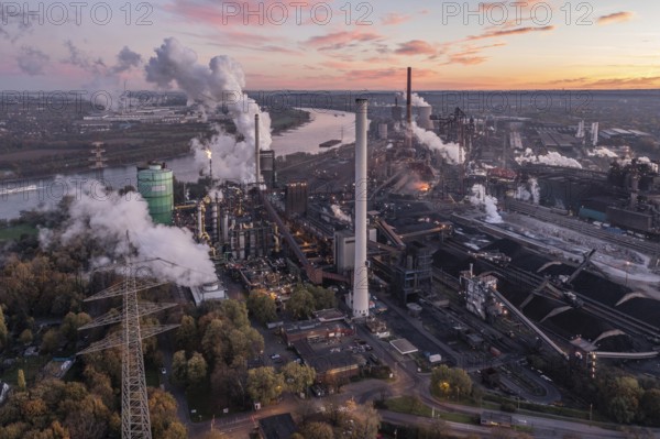 Metallurgical Plant in North Rhine-Westphalia at dawn. In addition to a steel mill, it operates a coke plant, blast furnaces, a power plant and a sinter plant