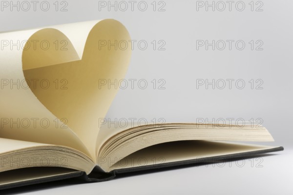 Book with two pages in a heart shape