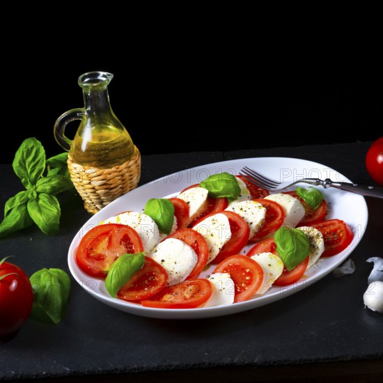 Tomatoes with mozzarella and basil