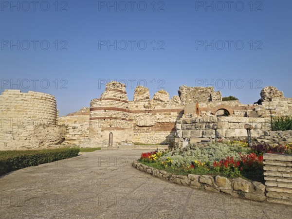 Ancient ruins of Nessebar, weathered brick and stone walls remnants of Byzantine fortress structure. Thracian settlement Mesembria now the old town of Nesebar, UNESCO world heritage in Bulgaria
