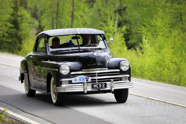 1949 Plymouth P-17 Deluxe Business Coupe on Ascension Day vintage car rally by AHS ry, road 104, Fiskars, Finland. May 26, 2022