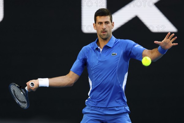 MELBOURNE, AUSTRALIA, JANUARY 11: Novak Djokovic of Serbia plays Stefanos Tsitsipas of Greece during a charity match ahead of the 2024 Australian Open at Melbourne Park on January 11, 2024 in Melbourne, Australia, Oceania