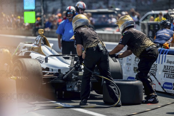 INDYCAR driver, RINUS VEEKAY (21) of Hoofddorp, Netherlands, brings his Ed Carpenter Racing Chevrolet car in for a pit stop during the Pit Stop Competition at the Indianapolis Motor Speedway in Indianapolis, IN, USA, North America