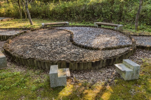 Yin yang symbol made of wooden posts and cemented rocks in wilderness park, Gongju, South Korea, Asia