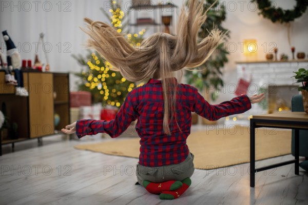 A joyful moment that beautifully captures the festive spirit with a playful young girl celebrating the holidays