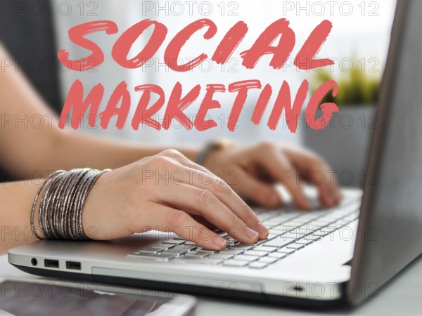 Social marketing concept. Close-up woman's hands using laptop keyboard for social media