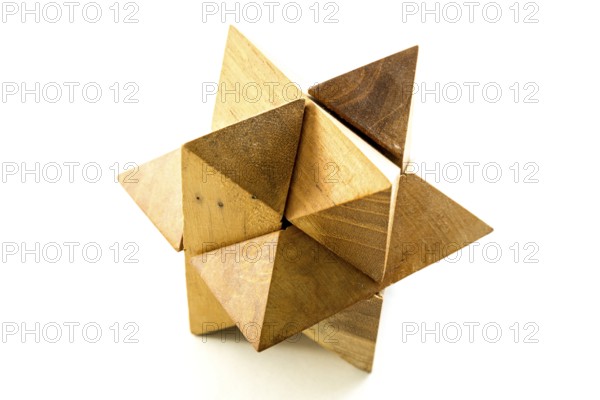 Wooden puzzle isolated on a white background