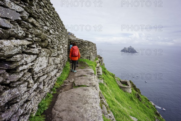Visitors on the steep path up to the monastery, Skellig Michael island, Mainistir Fhionáin (St. Fionan?s Monastery), county Kerry, Ireland, United Kingdom, Europe