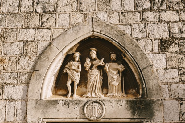 Dubrovnik, Croatia - 04 may 2016: Close-up stone statues, bas-reliefs and high reliefs on the walls of the old city of Dubrovnik, Croatia, Europe