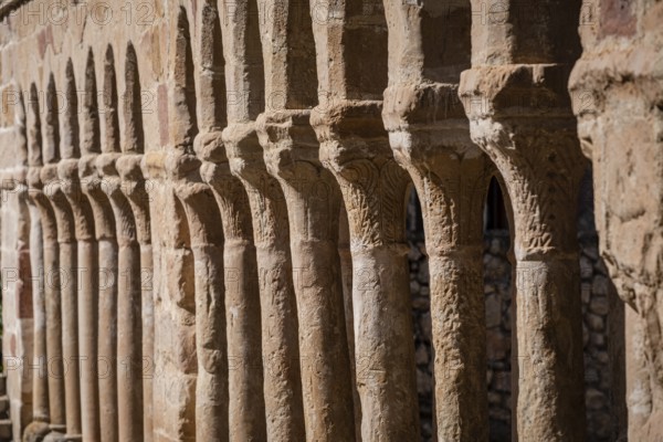 Arcaded gallery of semicircular arches on paired columns, Church of the Savior, 13th century rural Romanesque, Carabias, Guadalajara, Spain, Europe