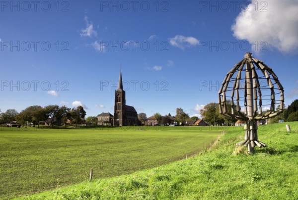 Artworks in the form of a tree along the dike of the river Maas near Batenburg in the province of Gelderland