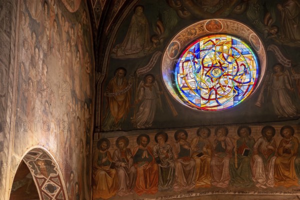 SAN GIMGNANO, ITALY, SEPTEMBER 20, 2023, Colorful old frescoes at the main aisle of the cathedral of San Gimignano