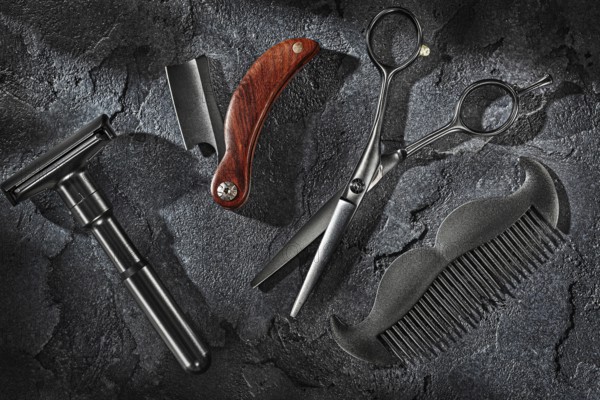 Black Barbers Tools Set On Sone Slate Background