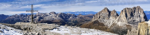 Panoramic photo with summit cross of the Saß Pordoi, in the Dolomites, South Tyrol, Italy, Europe
