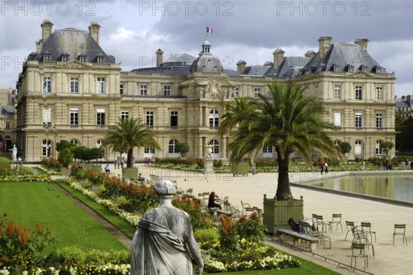 Jardin du Luxembourg in the centre of Paris. In the background the Palais du Luxembourg, in the foreground well-tended flowerbeds and borders. Landscape format. In the background the Palais du Luxembourg, in the foreground well-tended flowerbeds. Horizontal format
