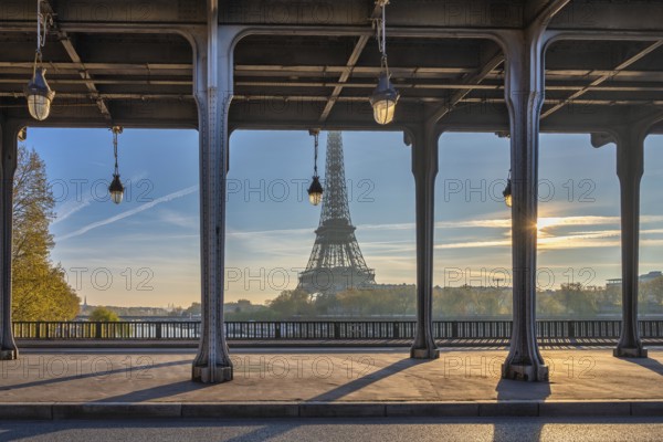 Paris France, sunrise city skyline at Eiffel Tower and Seine River Bir-Hakeim Bridge