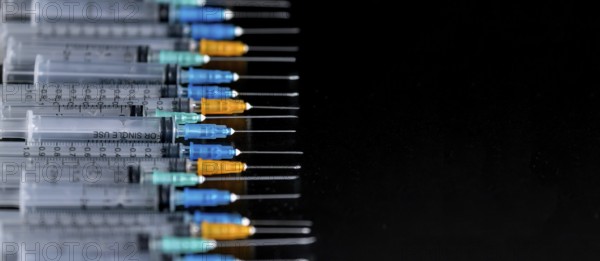 Medical Syringes with Needle on Black Background, Close up Syringe, Health care concept