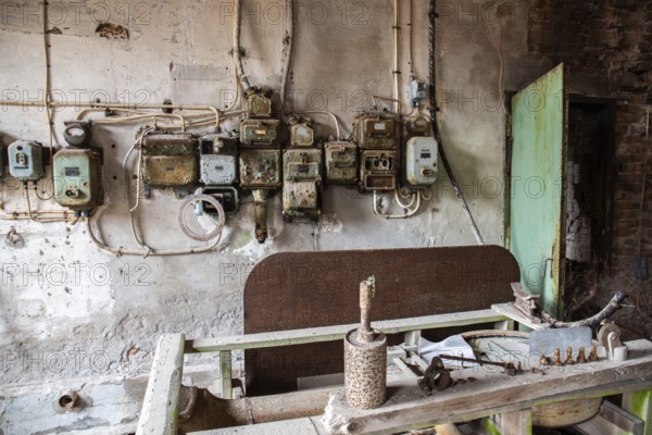 Old abandoned paper factory. Historic and typical factory building as a lost place. Destruction and decay are damaging the substance. Original machines and objects can be found here in Sweden