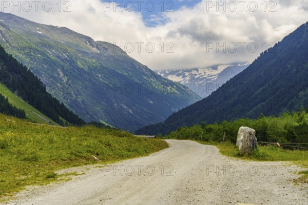 Road through a wide valley surrounded by high mountains, Mittersell, Hohe Tauern, Alps, Austria, Europe