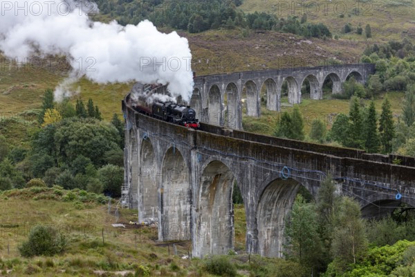 The Jacobite Steam Train, steam railway on the Glenfinnan railway viaduct, known from Harry Potter, Glenfinnan, Highlands, Scotland, Great Britain
