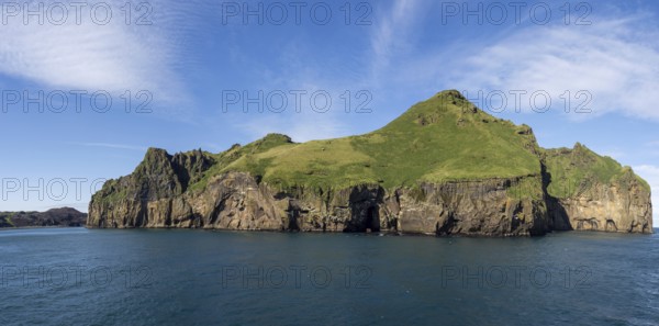 Steep cliffs in the blue sea, Westman Islands, Iceland, Europe