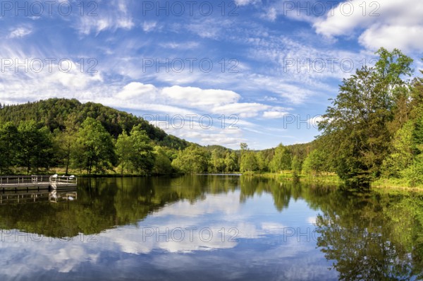 View at a lake in the Spiesswoogtal valley near the German village Fischbach bei Dahn in the Rhineland-Palatinate