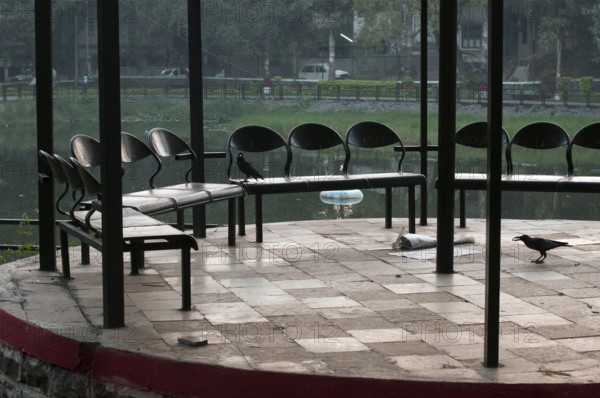 Chairs sitting arranged in garden Pune Maharashtra India Asia Feb 2012