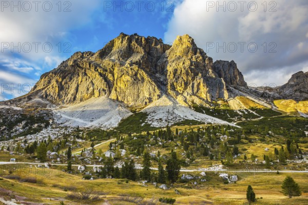 The concept of active and adventure tourism. Peaks rocks spectacularly stands on a background of clouds. Travel in the Dolomites, pass Faltsarego