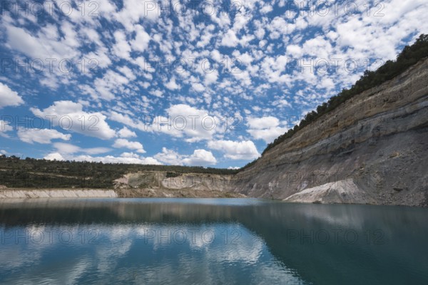 Turqoise lake in an open pit mine