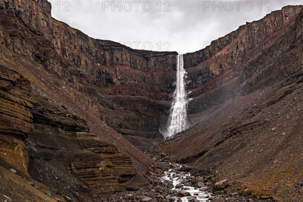 Hengifoss waterfall in eastside of Iceland in a cloudy day