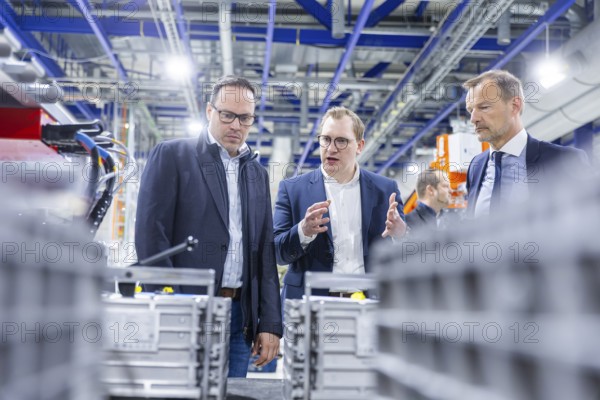 JT Energy Systems is the largest production centre for lithium-ion batteries in the intralogistics industry. On an area of 42, 000 m², lithium-ion batteries are produced and reconditioned to the highest quality standards using modern production technologies. Dirk Panter, Christoph Remmel (left) from JT Energy Systems, Prof Dr Jörg Scheibe, Freiberg, Saxony, Germany, Europe