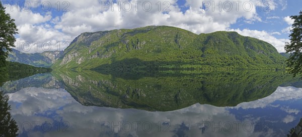 Mountain range reflected in Lake Bohinj, Triglav National Park, Julian Alps, Gorenjska region or Upper Carniola, Slovenia, Europe