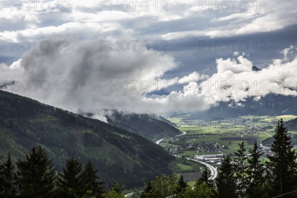 Clouds and fog over the Liesingtal, in the valley the village Traboch, Schoberpass federal road, view from the lowlands, Leoben, Styria, Austria, Europe