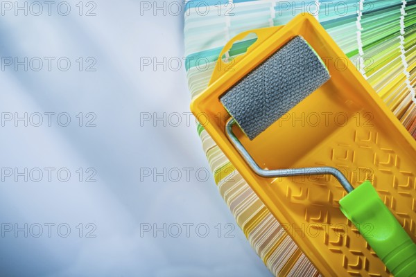 Color sampler paint roller tray on white surface