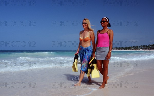 Two snorkellers on the beach, Punta Cana, Caribbean, Dominican Republic, Central America