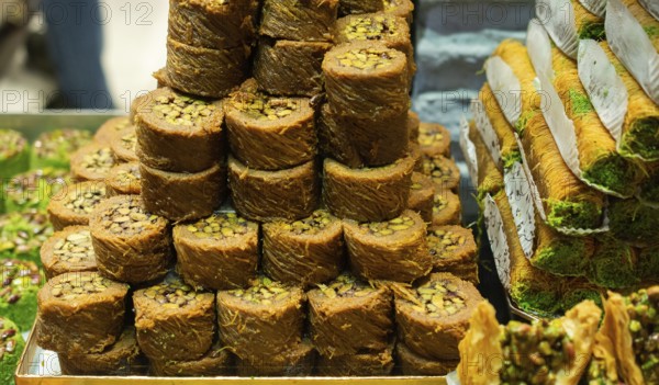 Turkish traditional dessert Kadayif baked in syrup served with nut powder