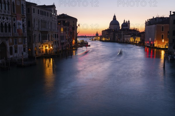 Morning atmosphere in front of sunrise, view of the Grand Canal from the Ponte dell' Accademia, Basilica Maria della Salute in the background, long exposure, Venice, Italy, Europe