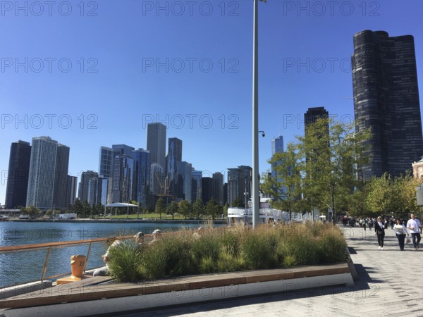 Walkway along the water with a view of modern skyscrapers, chicago, illinois, usa