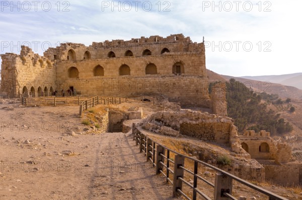 Al Karak, Jordan, November 4, 2022: Medieval Crusaders Castle in the center of the city and tourists, Asia