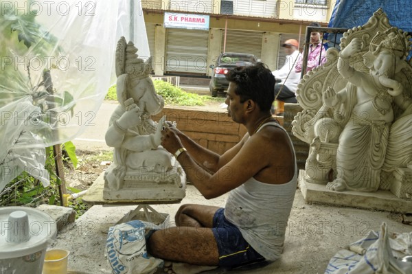 Man making Ganesh idol, alibag, Maharashtra, India, Asia