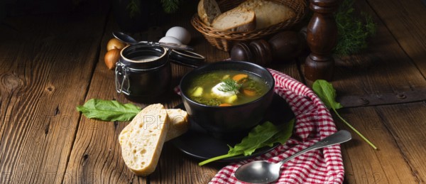 Rustic sorrel soup with potatoes and cream