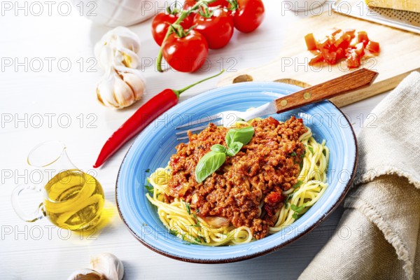 Delicious spaghetti bolognese on a white background