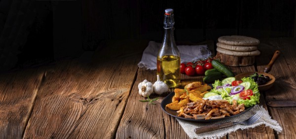 Rustic gyros plate it green salad and potato wedges
