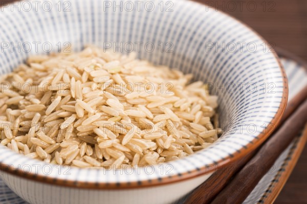 Raw brown rice in a bowl