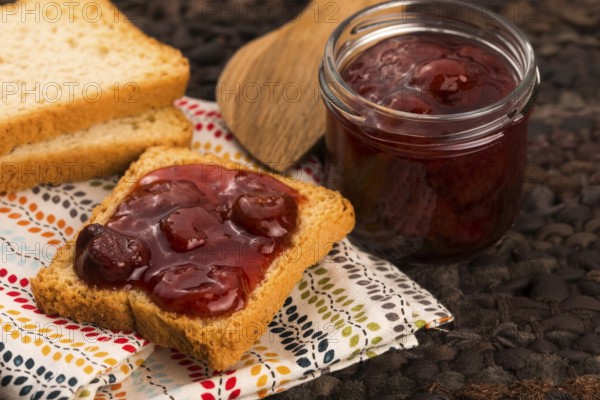 Breakfast of cherry jam on toast