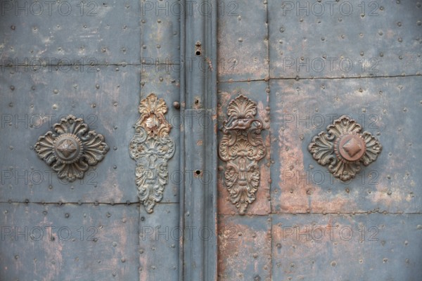 Door handle, ornate wrought ironwork, church door of the Church of the Merciful Brothers, Graz, Styria, Austria, Europe