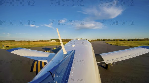 A small general aviation aircraft, its pre-takeoff checklist complete, taxis carefully to the active runway. Following precise instructions from the control tower, it prepares for takeoff, Concord, United States of America