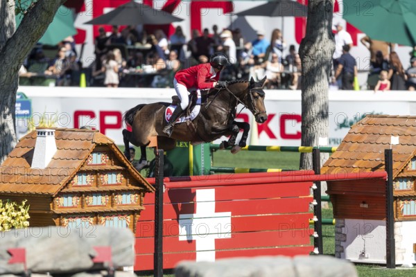 Martin Fuchs of Switzerland, riding Commissar Pezi competes in the BMO Nations Cup during the CSIO Spruce Meadows, Masters, in Calgary, Alberta, Canada, North America