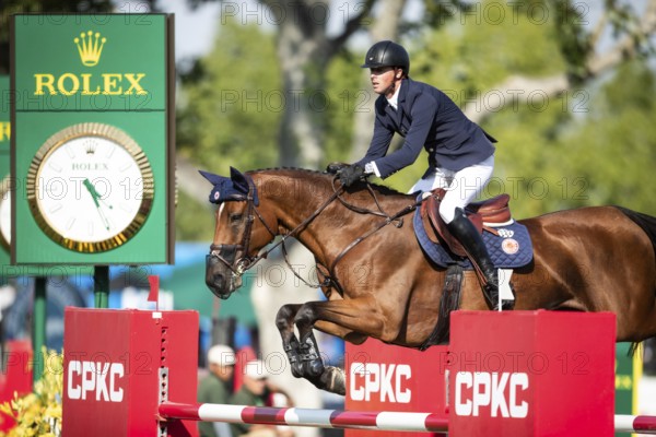 British rider Ben Maher riding Dallas Vegas Batilly competes in the second round and jumpoff of the CPKC International GP at Spruce Meadows Masters, in Calgary, Alberta, Canada, North America
